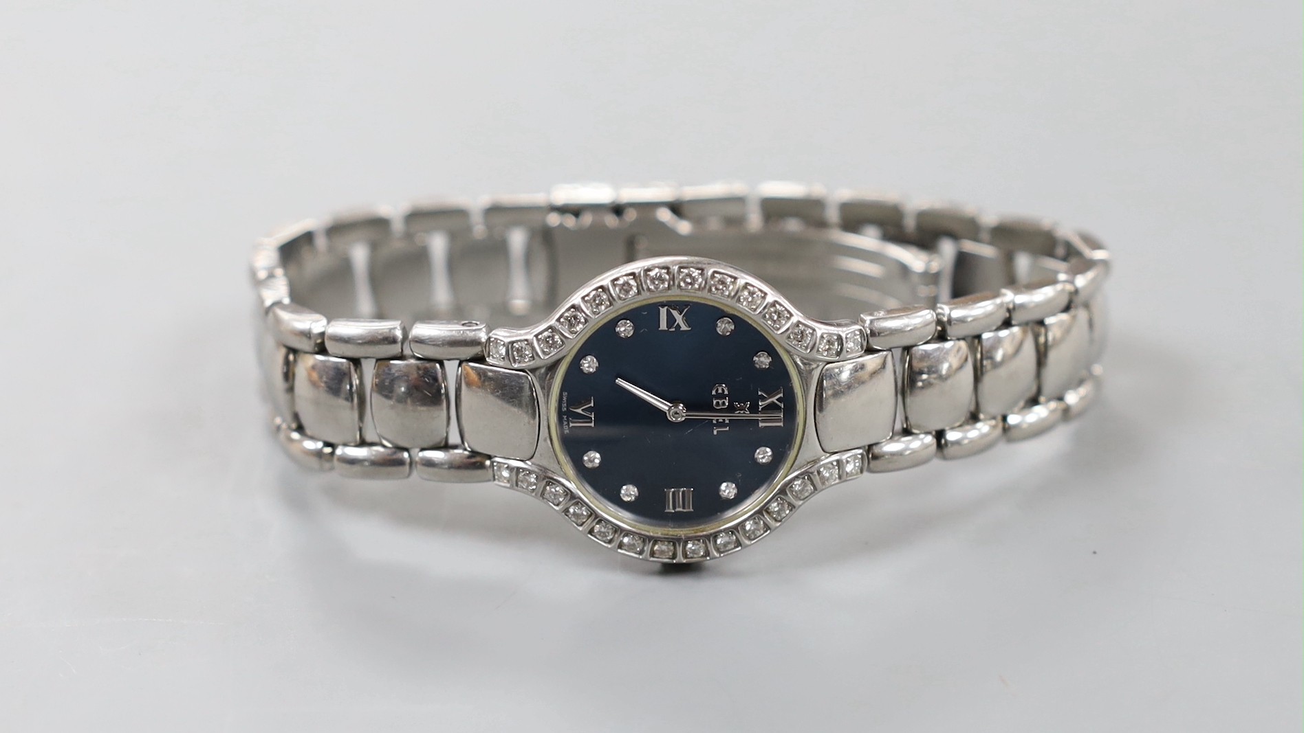 A lady's modern stainless steel Ebel quartz wrist watch and bracelet with diamond set dial and bezel, with box and papers.